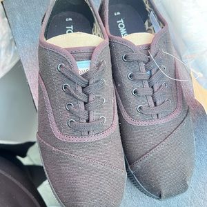 All black Platform Toms shoes